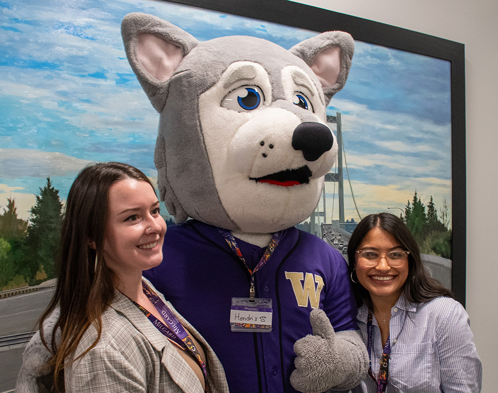 Photo of Hendrix mascot with two students