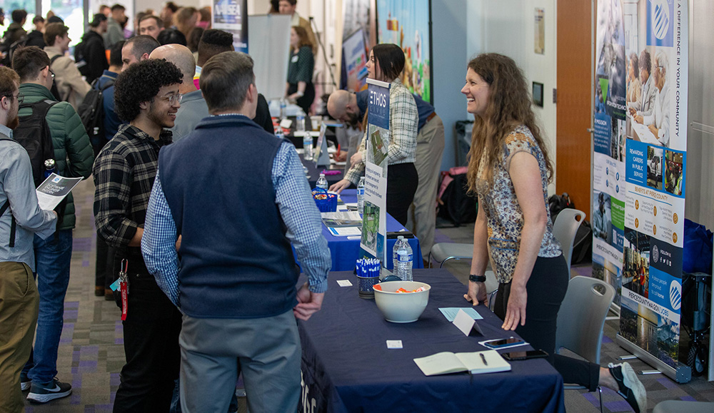 Photo of people speaking at career fair