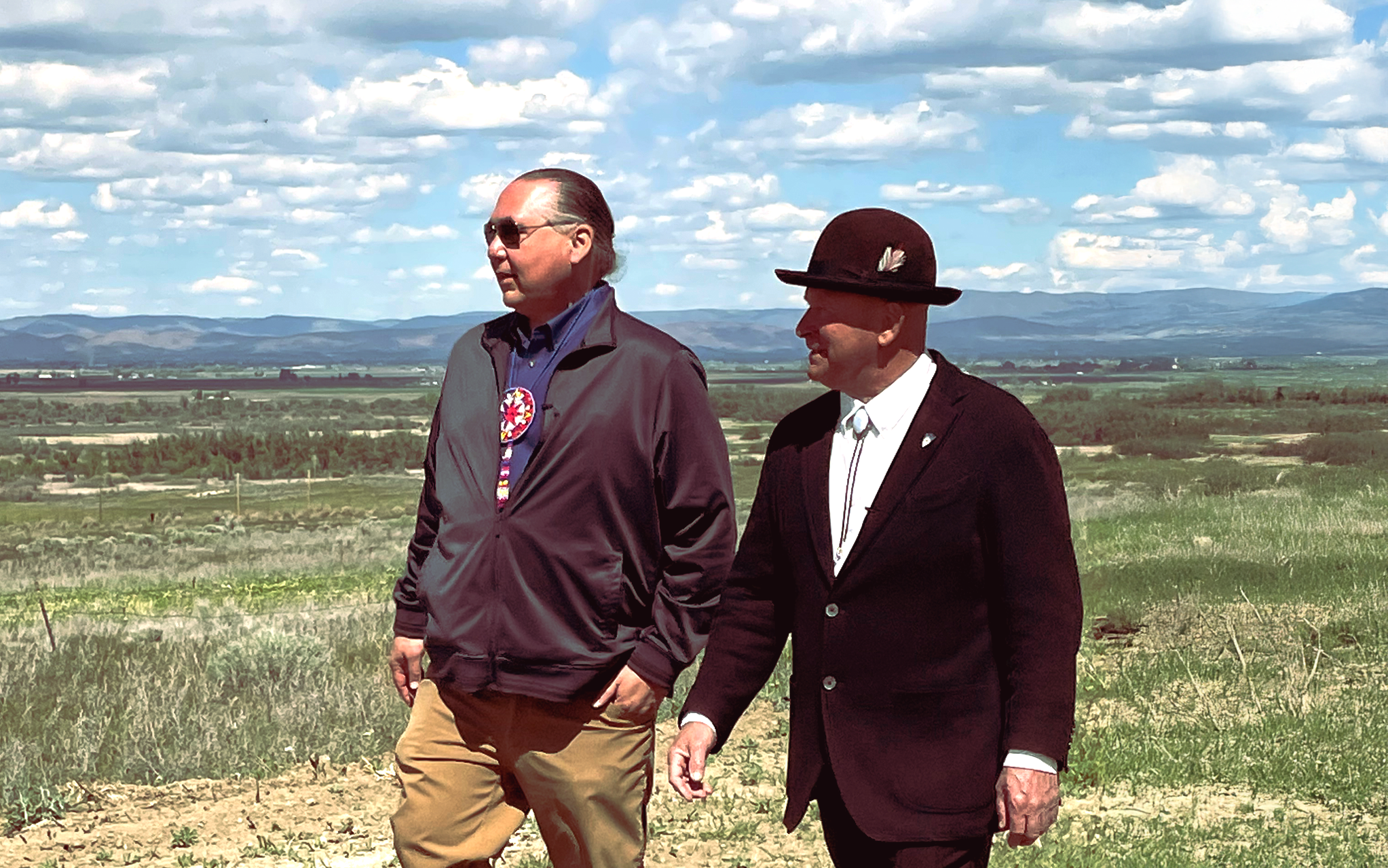 Phil Rigdon (Yakama Nation) and Urban Eberhart (farmer and irrigator) walk together in the Yakima Basin. Photo / Michael Kern