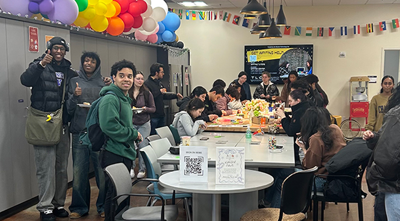 Students around a table in the Equity kitchen