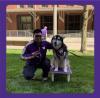 photo of Santino Wong. He is crouching next to Dubs, the husky mascot dog, and Santino is making a W with his fingers.
