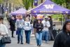 Students walking in a group outside at huskyfest