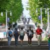 Students walking at the grand staircase in front of the steel W